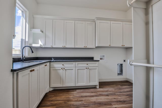 kitchen with dark wood-type flooring, sink, and white cabinets