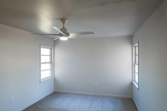 unfurnished room with carpet and ceiling fan