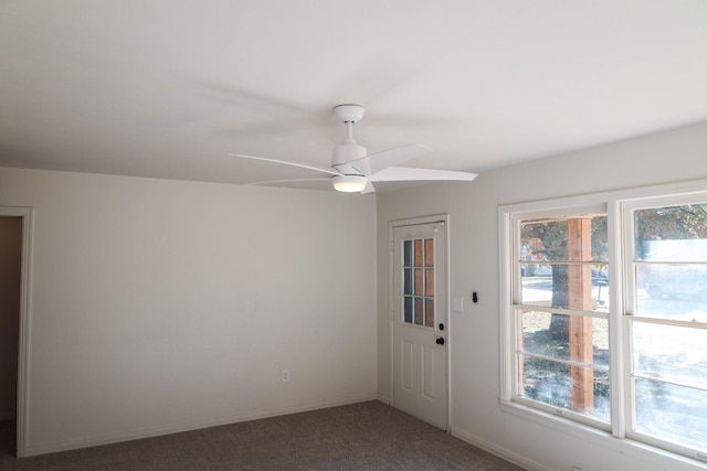 interior space with ceiling fan and carpet floors