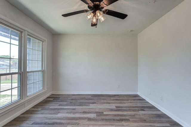 empty room featuring ceiling fan and light hardwood / wood-style floors