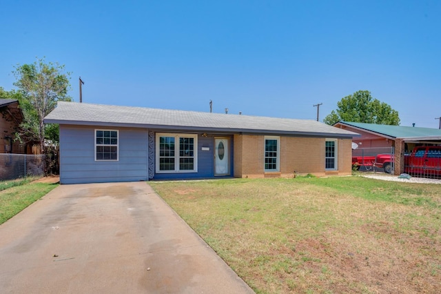 ranch-style home featuring a front yard