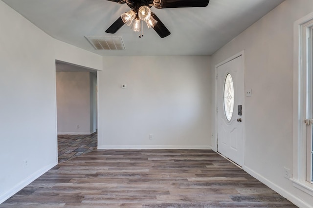 entryway with ceiling fan and wood-type flooring