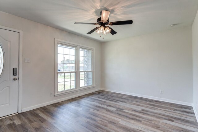 foyer featuring ceiling fan and light wood-type flooring