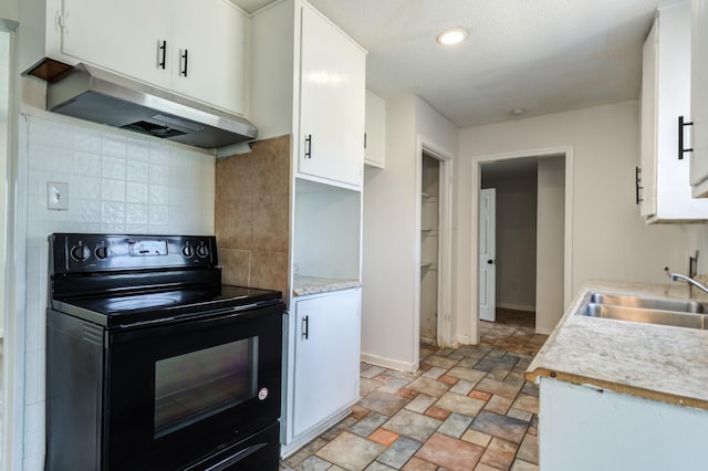 kitchen with white cabinetry, black range with electric stovetop, sink, and tasteful backsplash