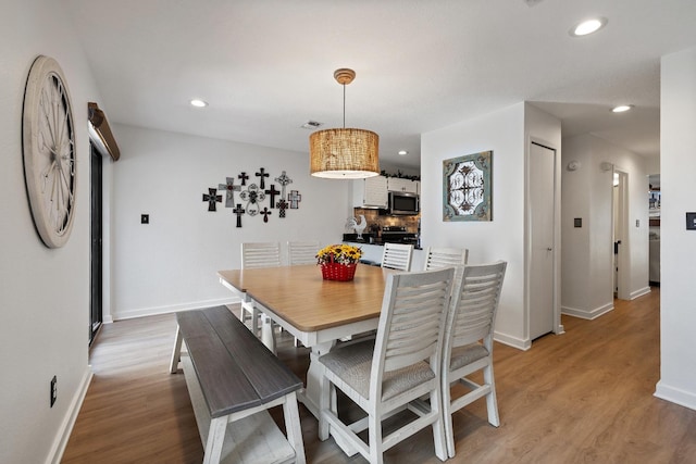 dining room featuring light hardwood / wood-style flooring