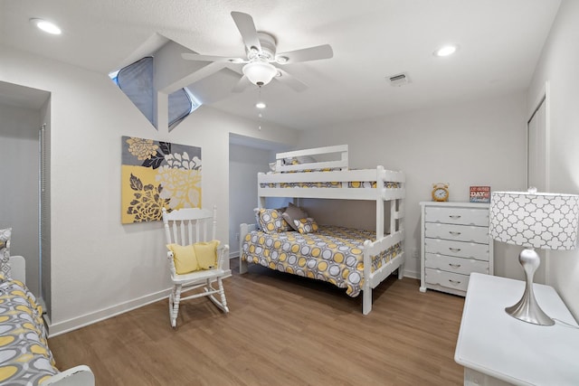 bedroom featuring hardwood / wood-style flooring and ceiling fan