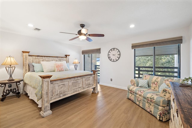 bedroom featuring hardwood / wood-style flooring and ceiling fan