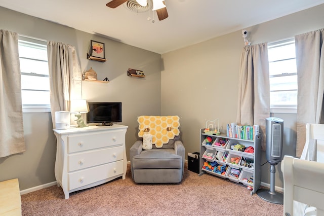 playroom featuring baseboards, a ceiling fan, and carpet floors