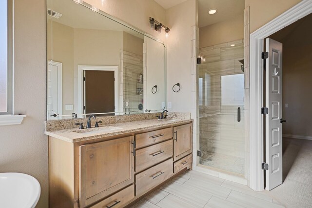 bathroom with vanity and independent shower and bath