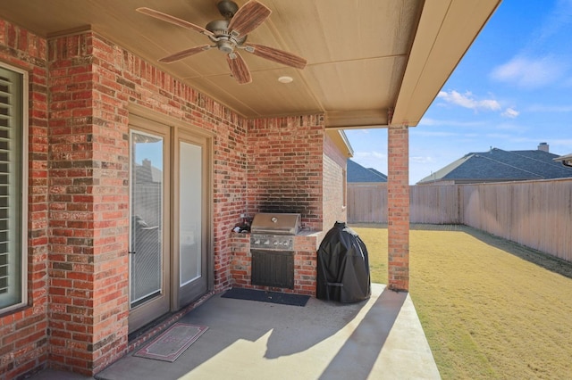 view of patio featuring ceiling fan and grilling area