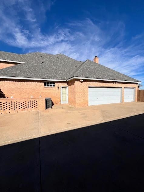 view of property exterior featuring a garage