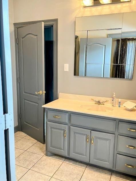 bathroom featuring tile patterned floors and vanity