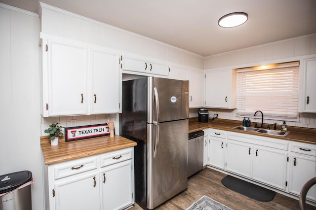 5303 46th St, Lubbock, TX 79414 - kitchen with ornamental molding, a sink, backsplash, and stainless steel appliances