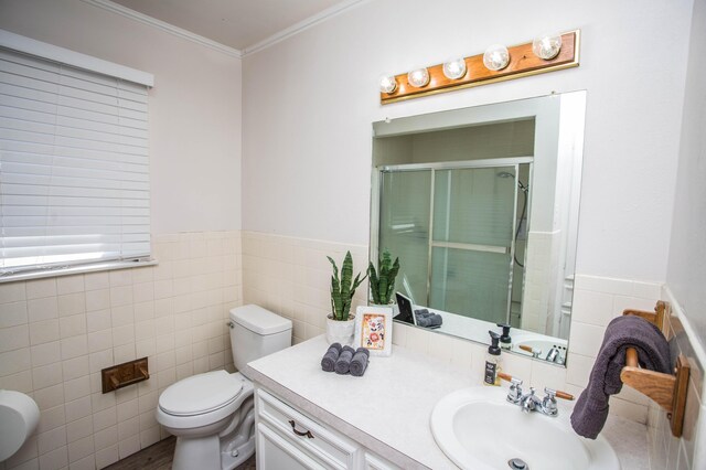 5303 46th St, Lubbock, TX 79414 - full bath with ornamental molding, toilet, tile walls, vanity, and a stall shower