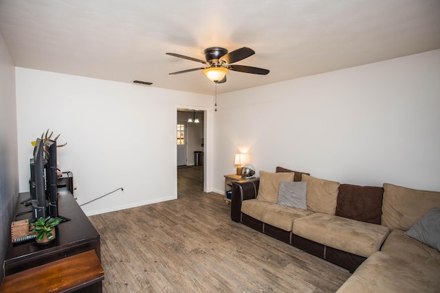 5303 46th St, Lubbock, TX 79414 - living room with visible vents, ceiling fan, wood finished floors, and baseboards