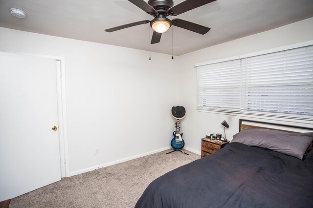 5303 46th St, Lubbock, TX 79414 - carpeted bedroom with baseboards and ceiling fan