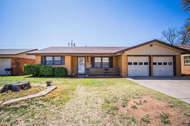 5303 46th St, Lubbock, TX 79414 - single story home featuring driveway, a front lawn, brick siding, a garage, and a shingled roof