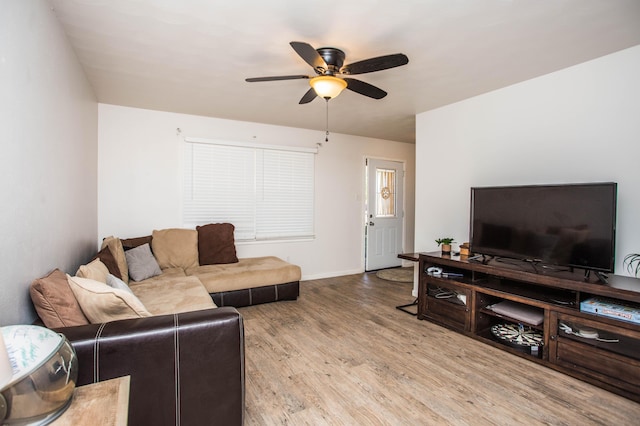 5303 46th St, Lubbock, TX 79414 - living area featuring baseboards, a ceiling fan, and wood finished floors
