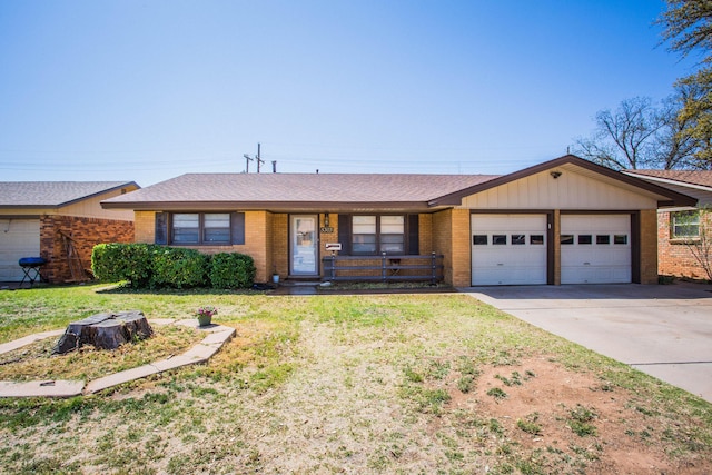 5303 46th St, Lubbock, TX 79414 - single story home featuring a garage, brick siding, a front lawn, and concrete driveway