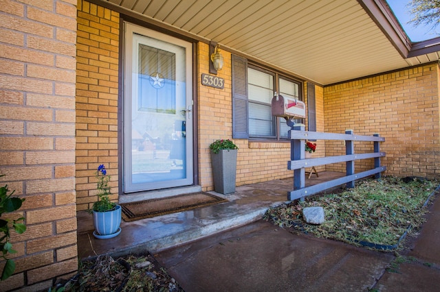 5303 46th St, Lubbock, TX 79414 - property entrance featuring a porch and brick siding