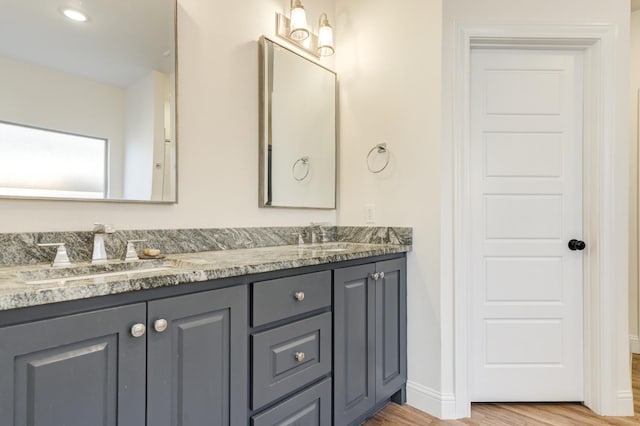 3621 121st St, Lubbock, TX 79423 - bathroom with double vanity and wood finished floors