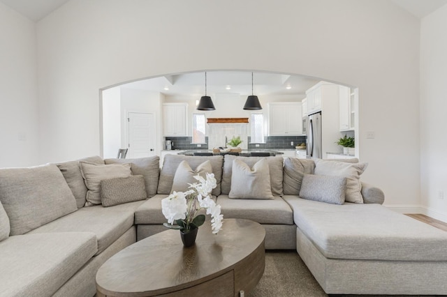 3621 121st St, Lubbock, TX 79423 - living area featuring arched walkways, recessed lighting, high vaulted ceiling, and wood finished floors