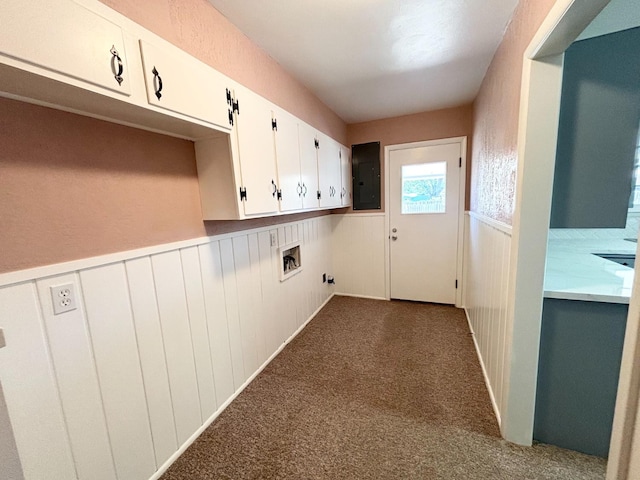 laundry room featuring sink, dark colored carpet, cabinets, electric panel, and hookup for a washing machine