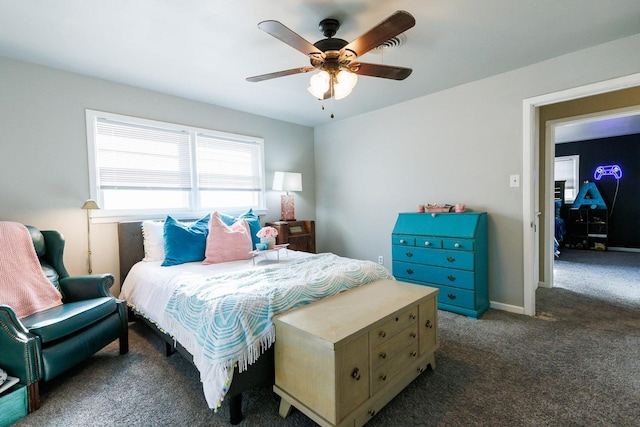 bedroom featuring dark carpet and ceiling fan