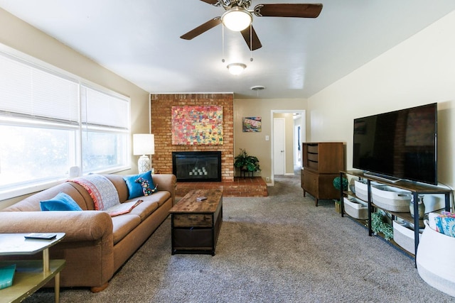 living room featuring ceiling fan, a fireplace, and carpet floors