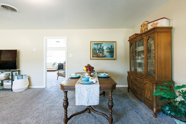 dining room featuring carpet flooring