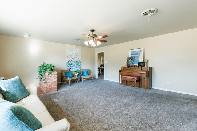 living room featuring ceiling fan and carpet flooring