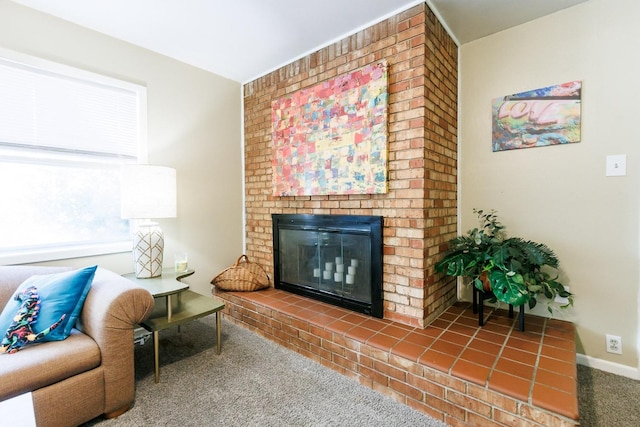 living room featuring a brick fireplace and carpet