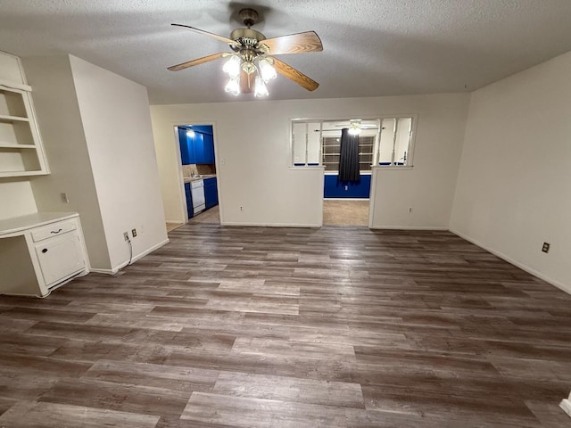 unfurnished living room with dark hardwood / wood-style flooring, a textured ceiling, and ceiling fan