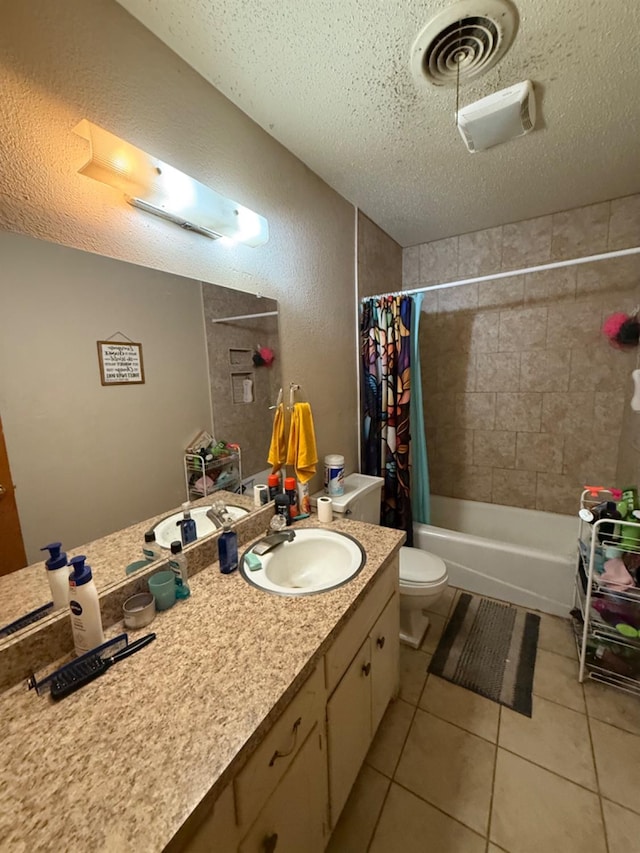 full bathroom with shower / bathtub combination with curtain, vanity, tile patterned floors, and a textured ceiling