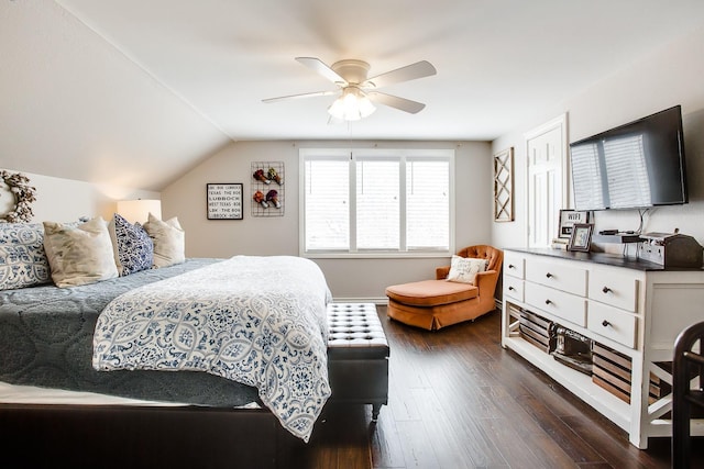 bedroom with ceiling fan, lofted ceiling, and dark hardwood / wood-style floors