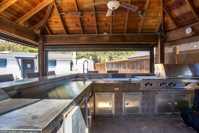 view of patio / terrace featuring a gazebo, an outdoor kitchen, sink, and ceiling fan