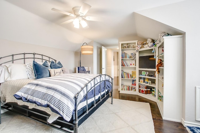 bedroom with wood-type flooring, vaulted ceiling, and ceiling fan