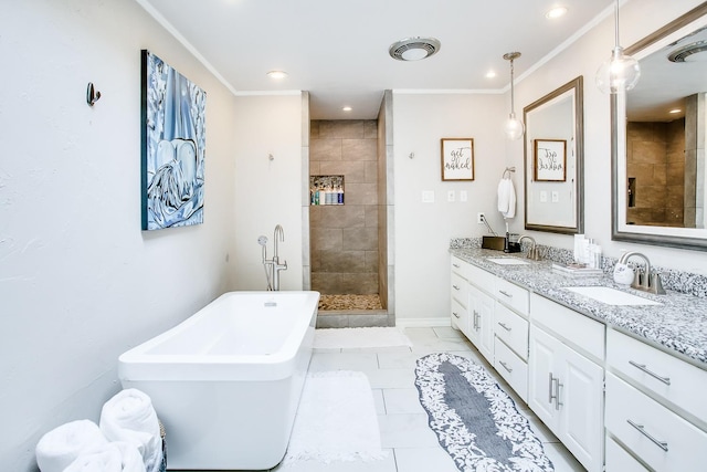 bathroom with vanity, ornamental molding, and separate shower and tub