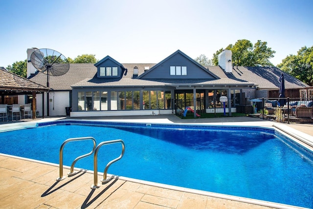 view of swimming pool with a gazebo and a patio area