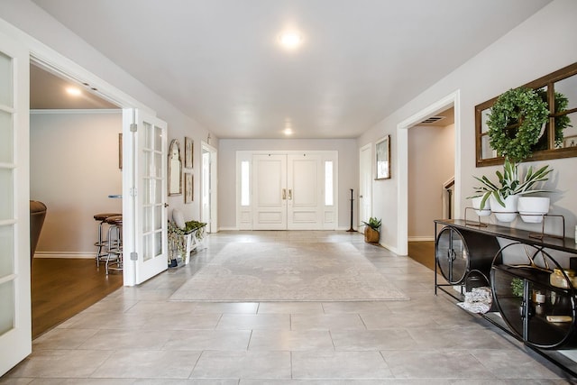 tiled entrance foyer with french doors