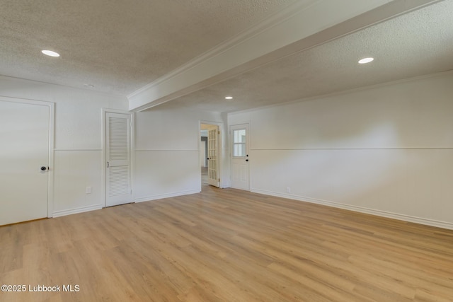 4013 48th St, Lubbock, TX 79413 - empty room featuring a textured ceiling, crown molding, light wood-style flooring, and recessed lighting