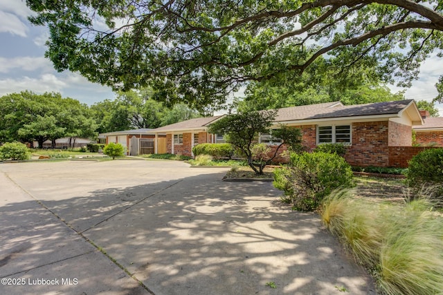 4013 48th St, Lubbock, TX 79413 - single story home featuring brick siding and driveway