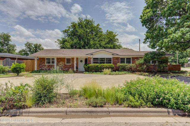 4013 48th St, Lubbock, TX 79413 - ranch-style house featuring driveway and brick siding