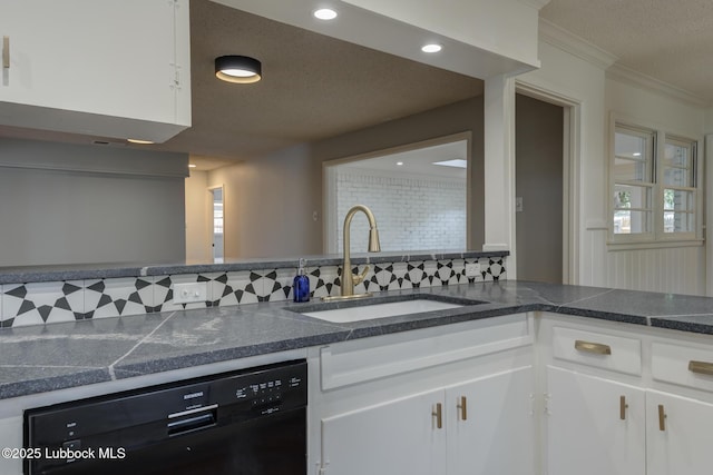 4013 48th St, Lubbock, TX 79413 - kitchen with dishwasher, tasteful backsplash, white cabinets, crown molding, and dark countertops