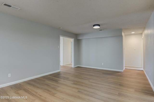 4013 48th St, Lubbock, TX 79413 - spare room featuring light wood finished floors and recessed lighting