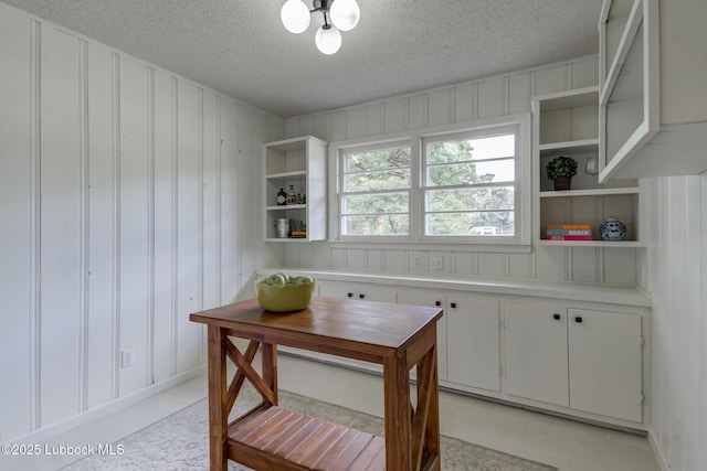 4013 48th St, Lubbock, TX 79413 - dining room with a textured ceiling and a decorative wall