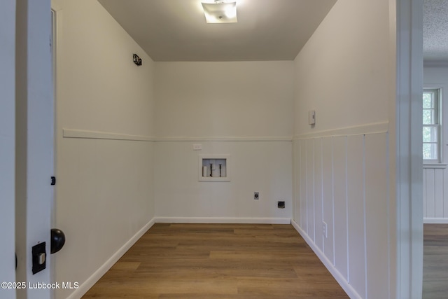 4013 48th St, Lubbock, TX 79413 - laundry room with hookup for an electric dryer, washer hookup, and wood finished floors