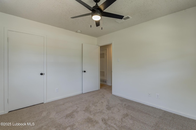4013 48th St, Lubbock, TX 79413 - unfurnished bedroom featuring carpet floors and a textured ceiling