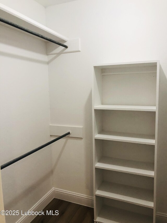 5712 73rd St, Lubbock, TX 79424 - spacious closet featuring dark wood finished floors