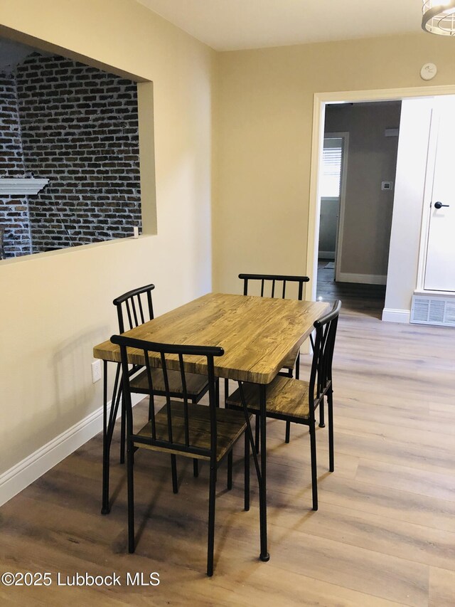 5712 73rd St, Lubbock, TX 79424 - dining space with baseboards and wood finished floors